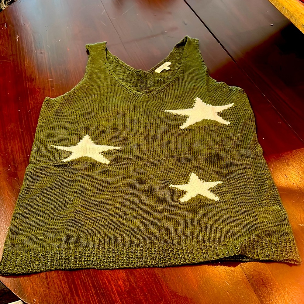 Hunter green tank top sweater with white star design. V-neck